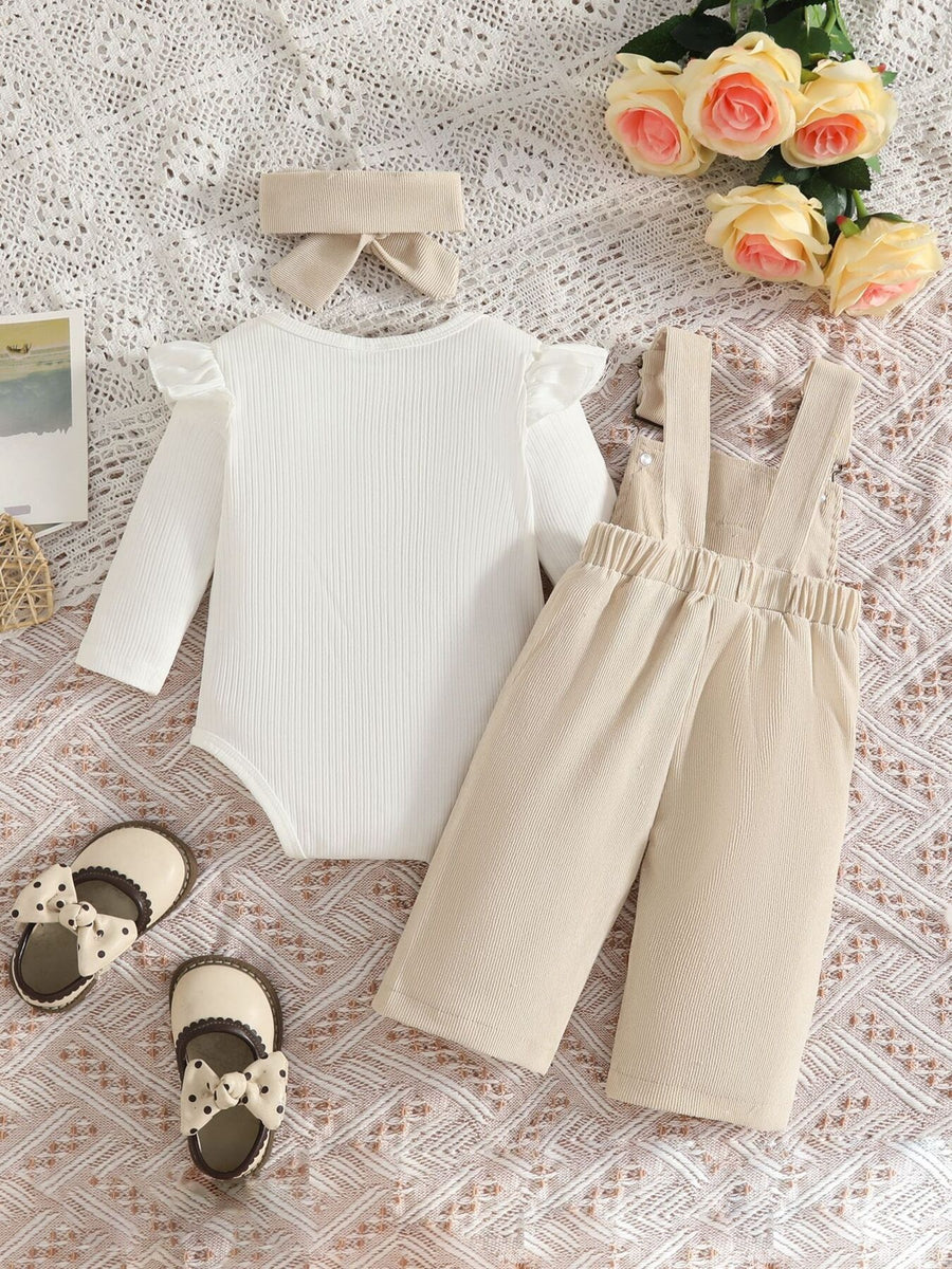 light beige overalls featuring ribbed and bow