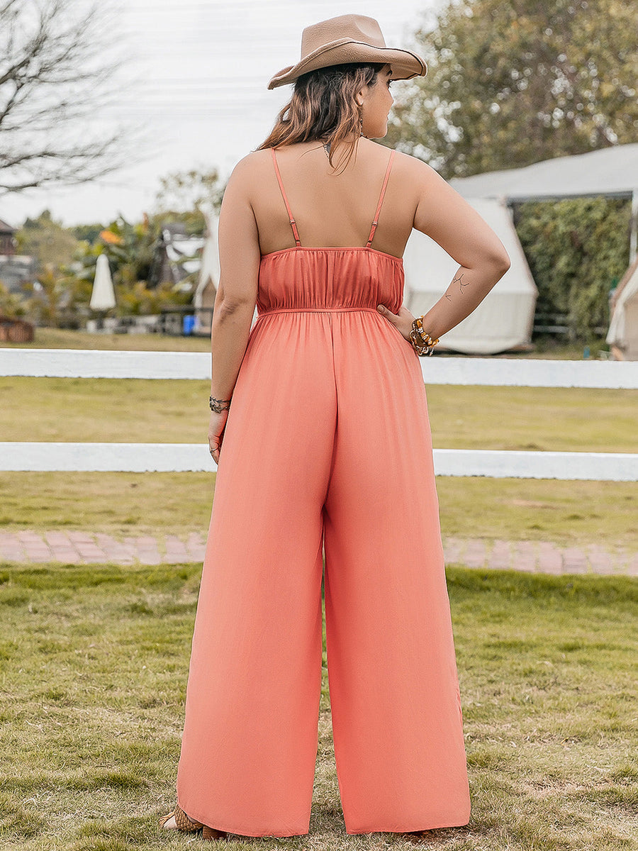 Orange embroidered bodice wide leg jumpsuit with spaghetti straps and a cinched waist.