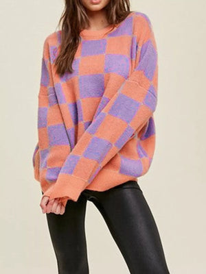 Chic checkerboard knit sweater in multicolor with crew neck and long sleeves.