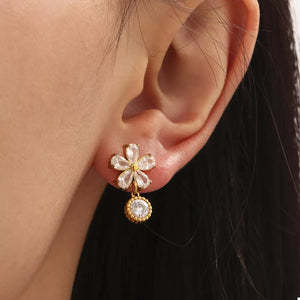 clear earrings featuring flower design and floral