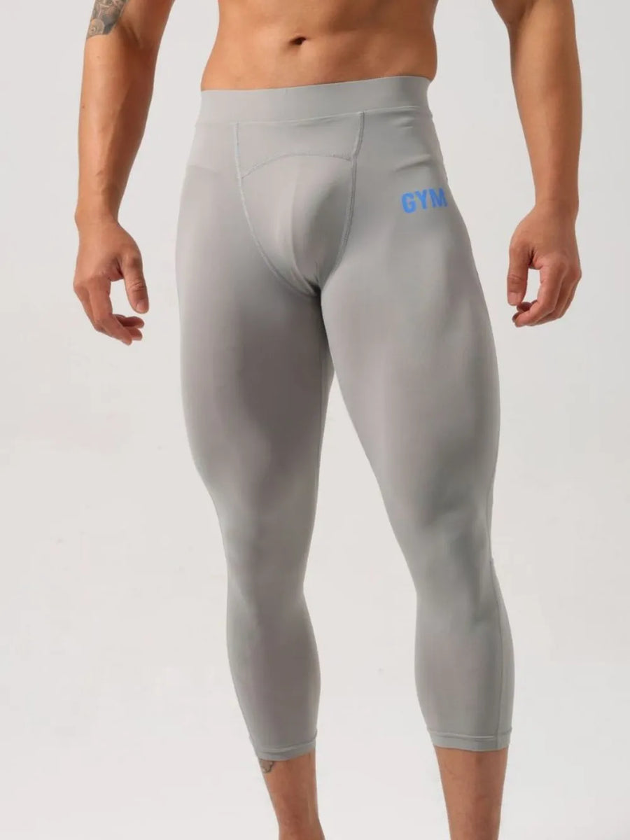 Gray compression capri leggings with blue GYM logo