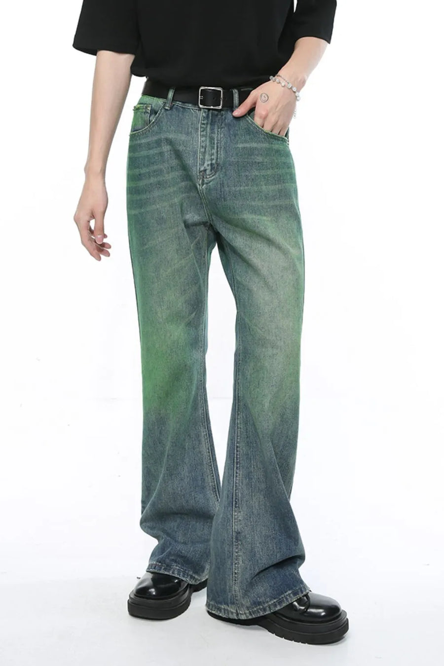 Ombre flare denim trousers in medium wash with a green gradient, cotton fabric, and a relaxed fit.