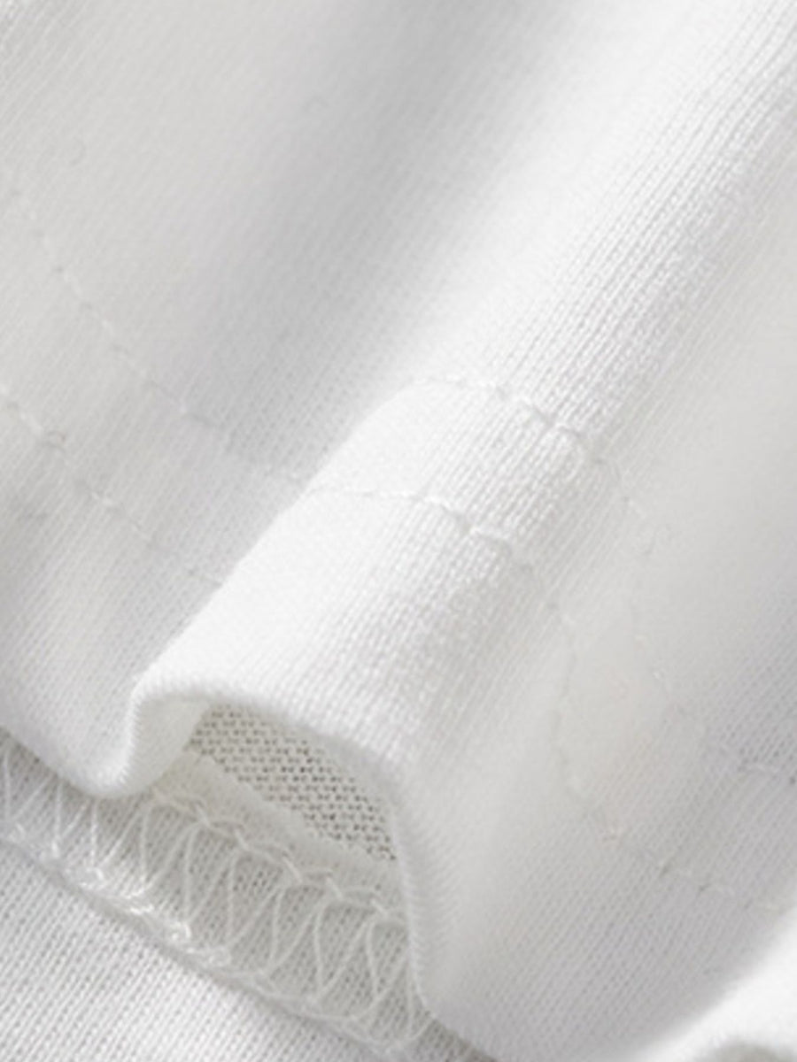 White cotton toddler t-shirt detail showing stitching and fabric texture.