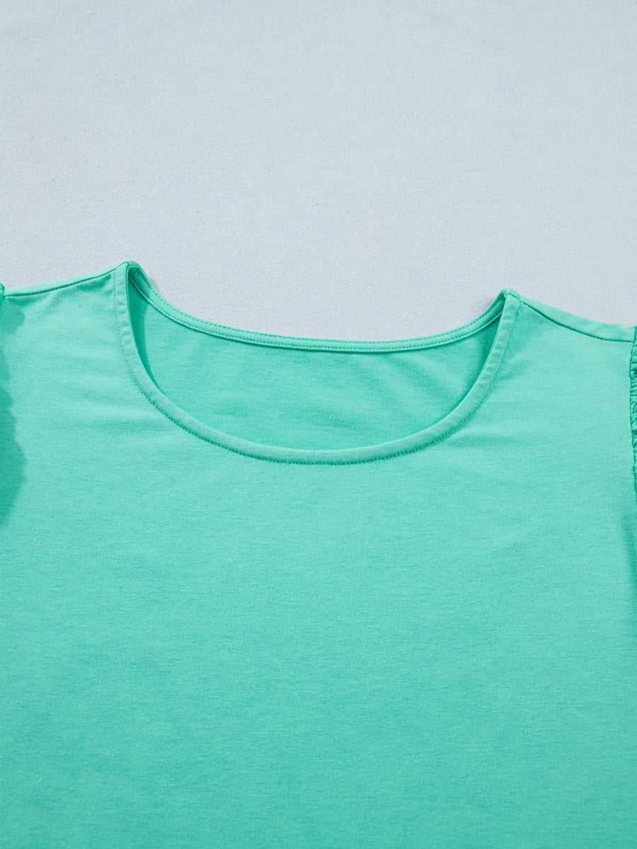 Eyelet lace ruffled cap sleeve top in mint green with a scoop neckline.