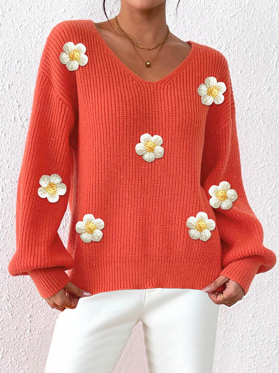 Khaki v-neck sweater featuring ribbed and floral