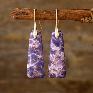 Textured purple stone drop earrings with gold accents.