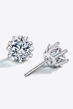 Silver stud earrings with a celestial cut moissanite and heart details.