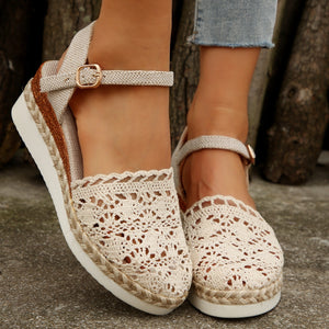 Ivory crochet espadrille wedge sandals with adjustable ankle strap and jute trim.