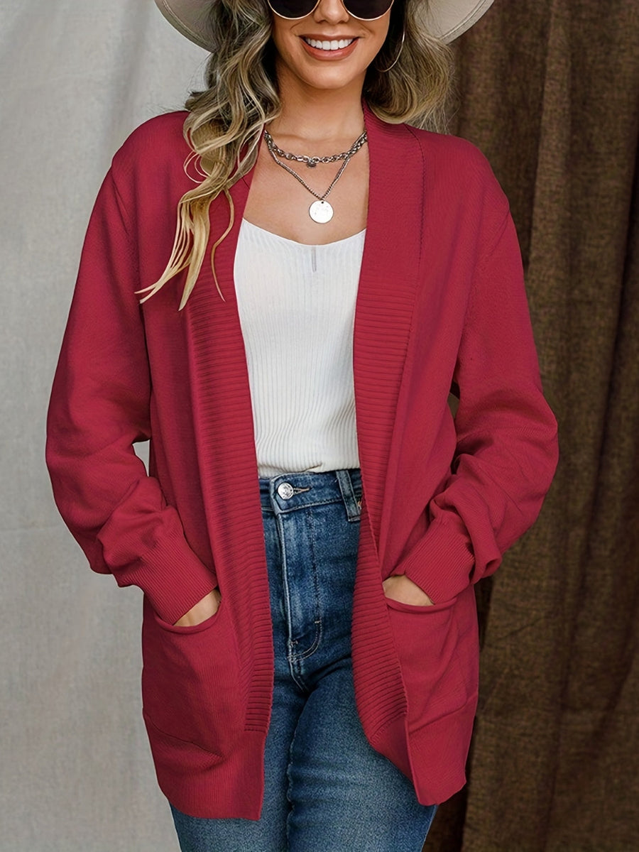 Deep red textured knit open-front cardigan with pockets and ribbed cuffs.
