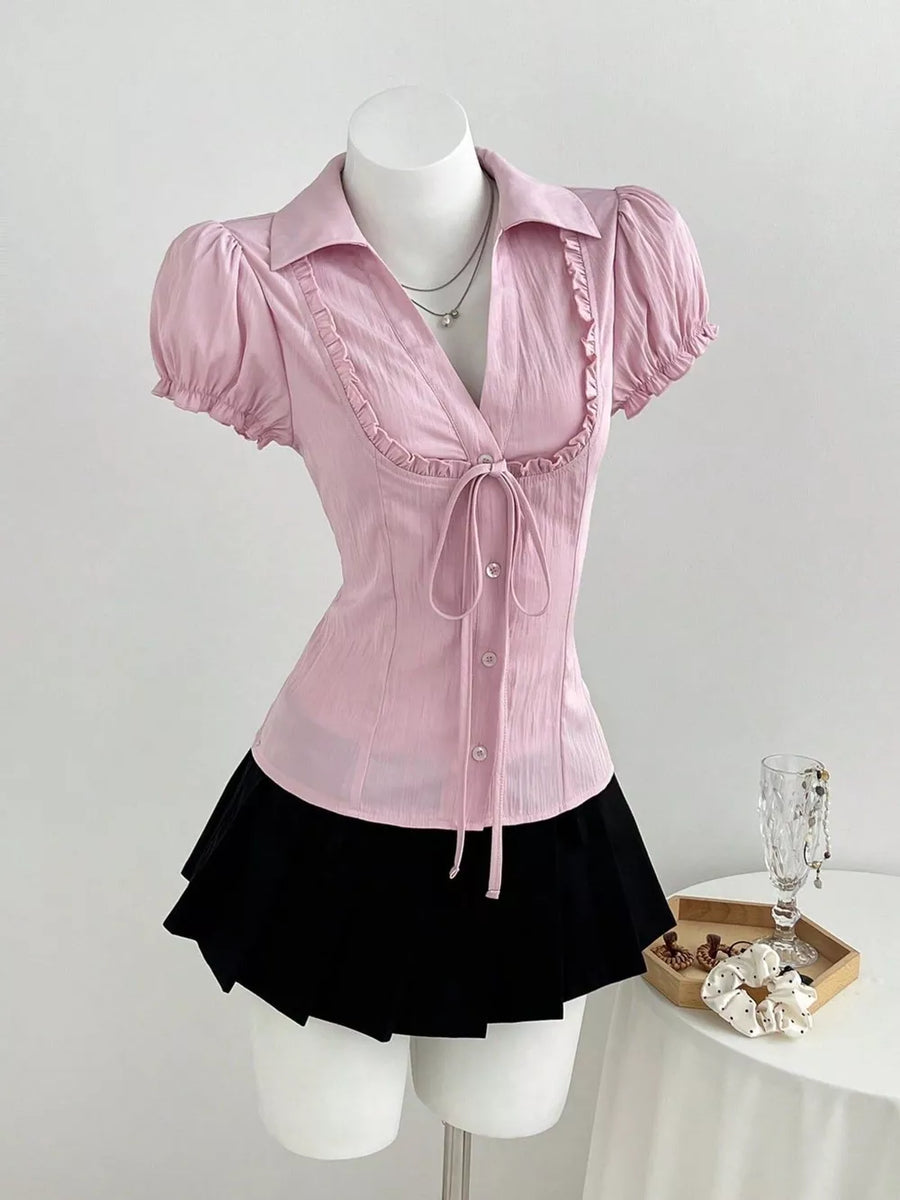 button-up shirt in light pink featuring tied and fitted fit