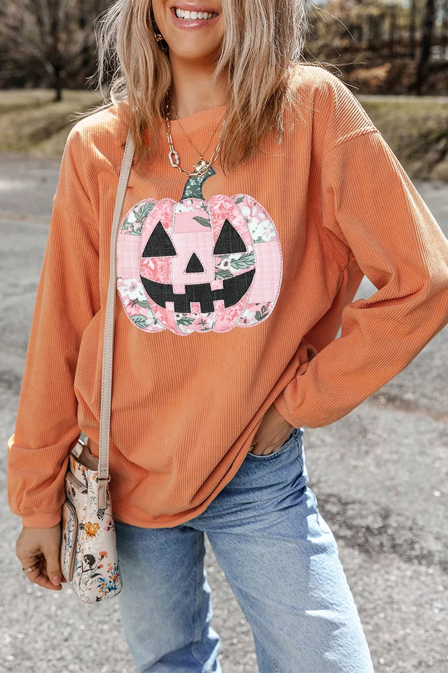 pink sweatshirt featuring sequin and graphic