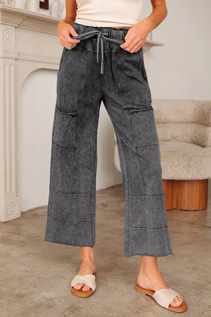 wide-leg pants in charcoal gray featuring drawstring and wide-leg fit