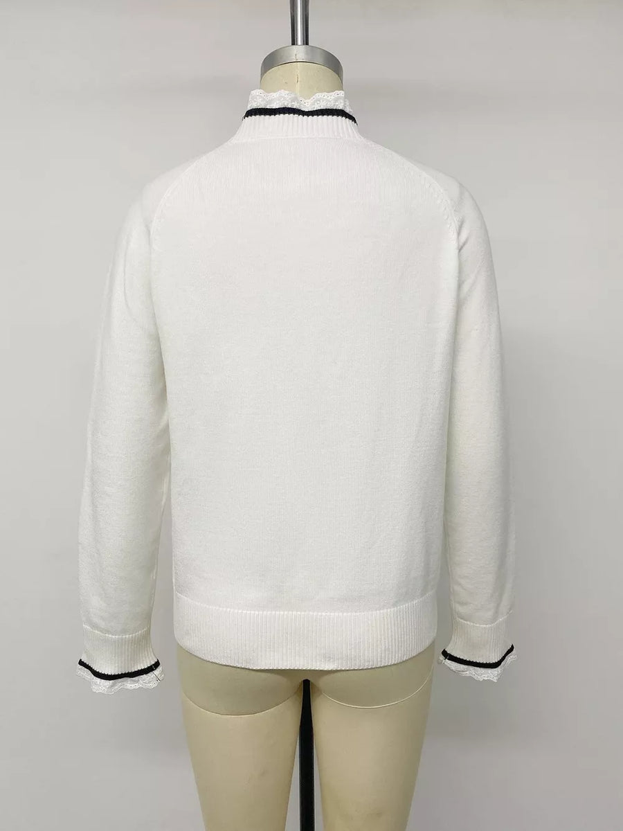 pullover sweater in ivory with bow and hip-length