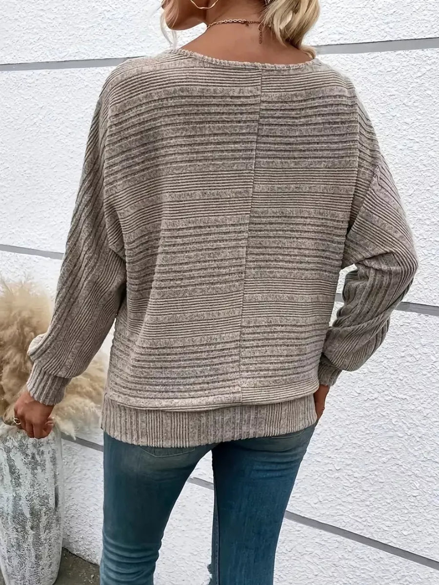 Khaki ribbed acrylic sweatshirt with dolman sleeves and a crew neck.