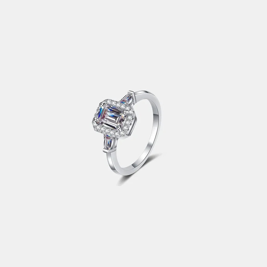 Emerald cut moissanite halo ring in sterling silver with baguette side stones