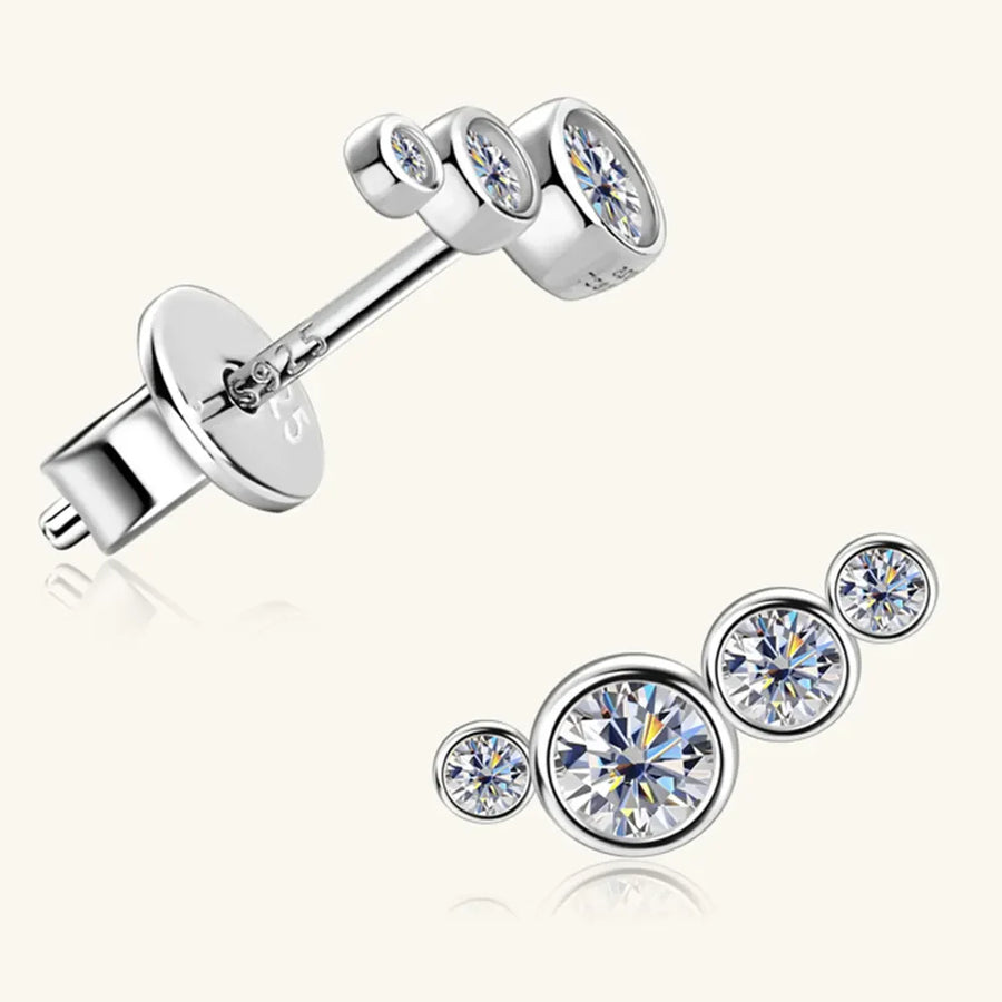 Silver ear climbers with four sparkling round cubic zirconia stones in a graduated cluster design.
