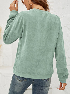 Sage green corduroy sweatshirt with crewneck and long sleeves.