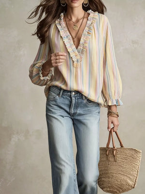 light pink blouse featuring ruffled and striped