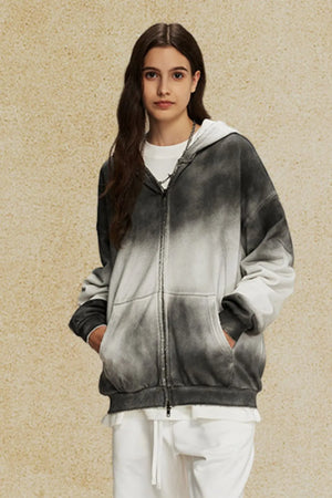 Ombre washed zip-up hoodie with a tie-dye effect in black and white, featuring a front zipper and pockets.