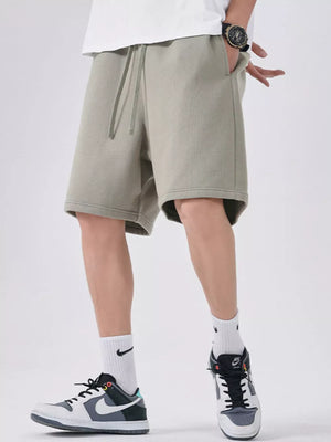 Sage chino shorts with drawstring waist and relaxed fit.