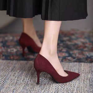 Point toe stiletto pumps in wine red suede, classic style.