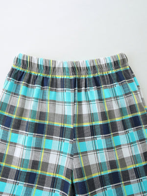 Boys' plaid shorts with elastic waistband in blue, gray, white, and yellow.