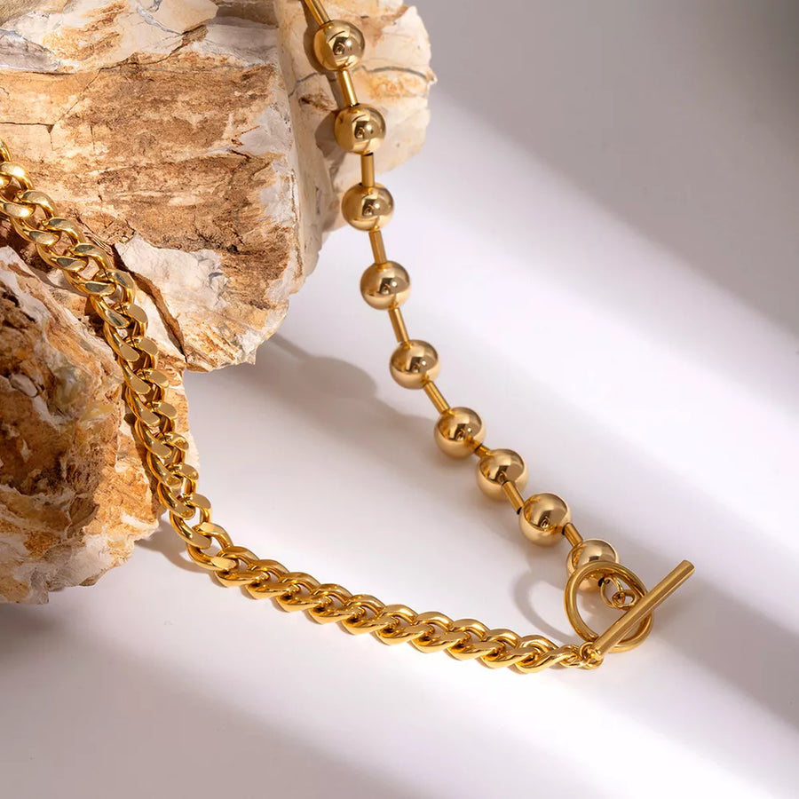 Gold necklace with collar and toggle clasp