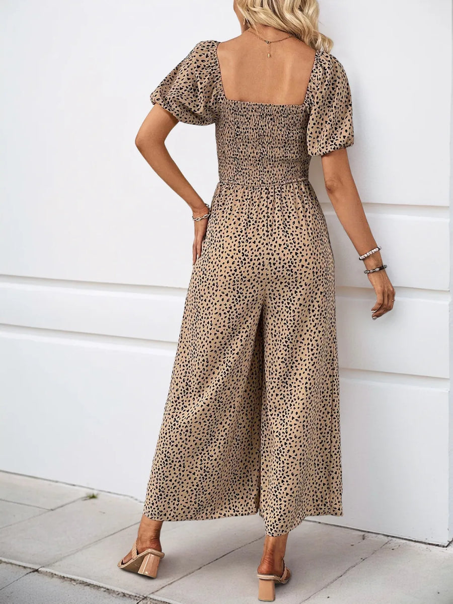 Smocked bodice leopard print jumpsuit with square neck and puff sleeves in tan.