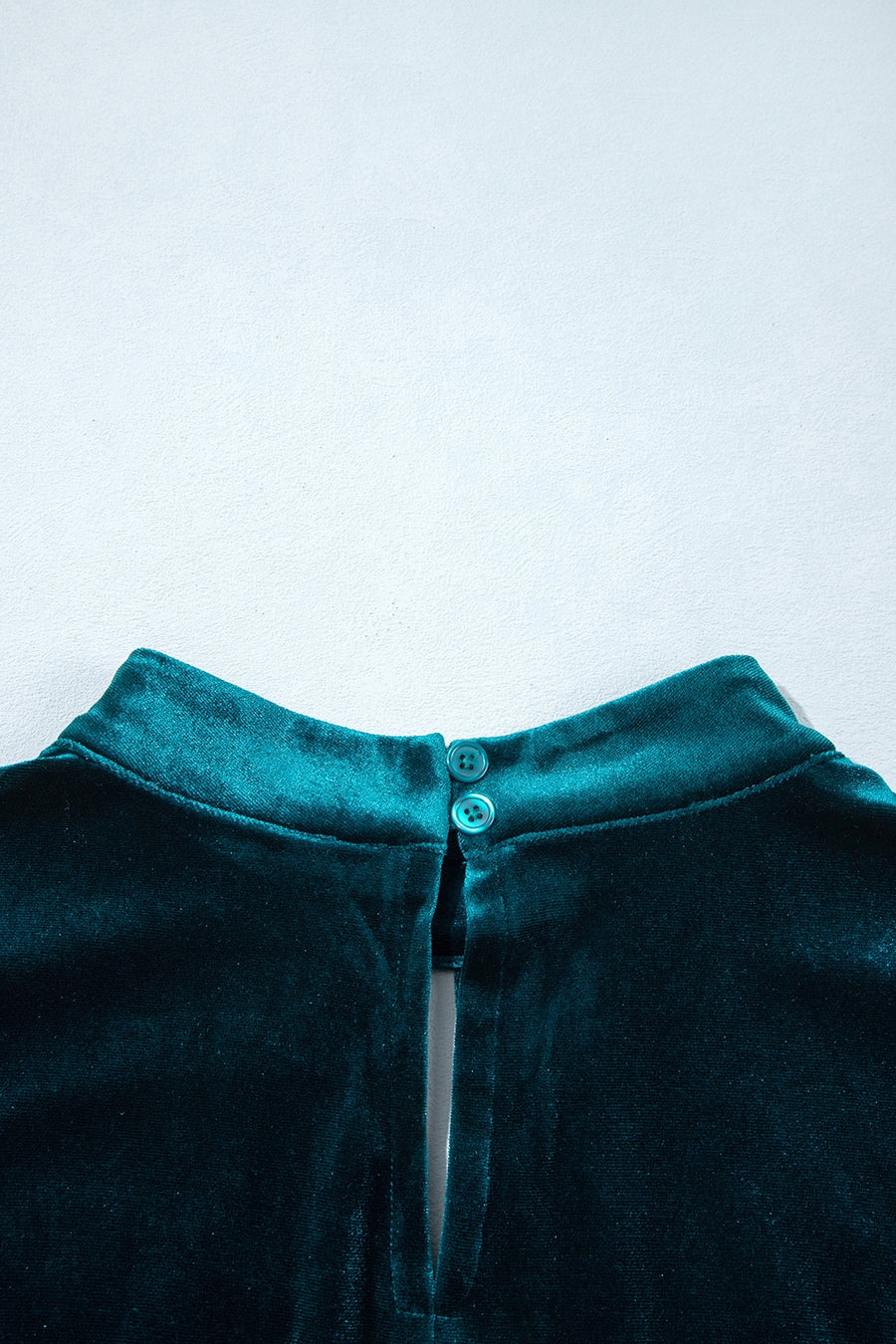 emerald green A-line mini dress with mock neck