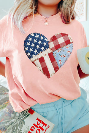Pink t-shirt with a patriotic heart graphic made of patchwork American flag and gingham patterns.