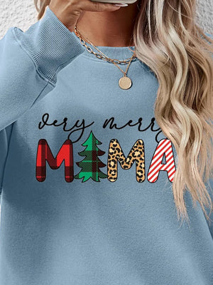 Misty Blue crewneck sweater with "Very Merry MAMA" graphic featuring plaid, tree, leopard print, and stripes.