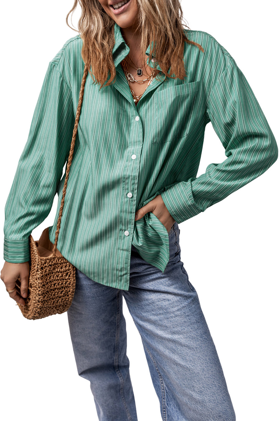 Oversized Sage stripe Oxford shirt with button front and pocket, styled with jeans.