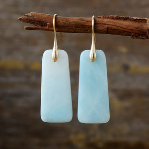 Aqua slab drop earrings with gold hooks, light blue marbled stone.