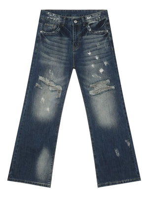Distressed flare denim jeans in medium wash cotton with raw edge finish and ripped details.