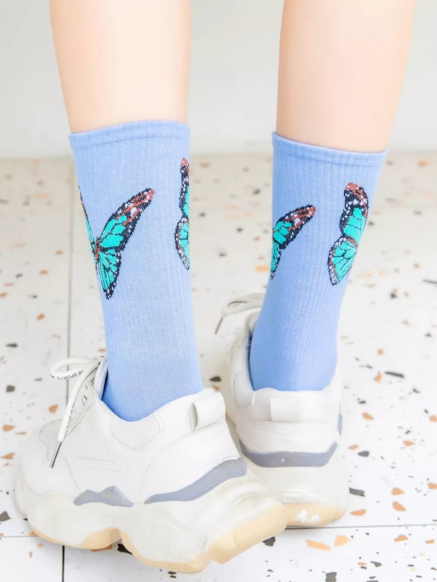 light blue socks with butterfly-print and null