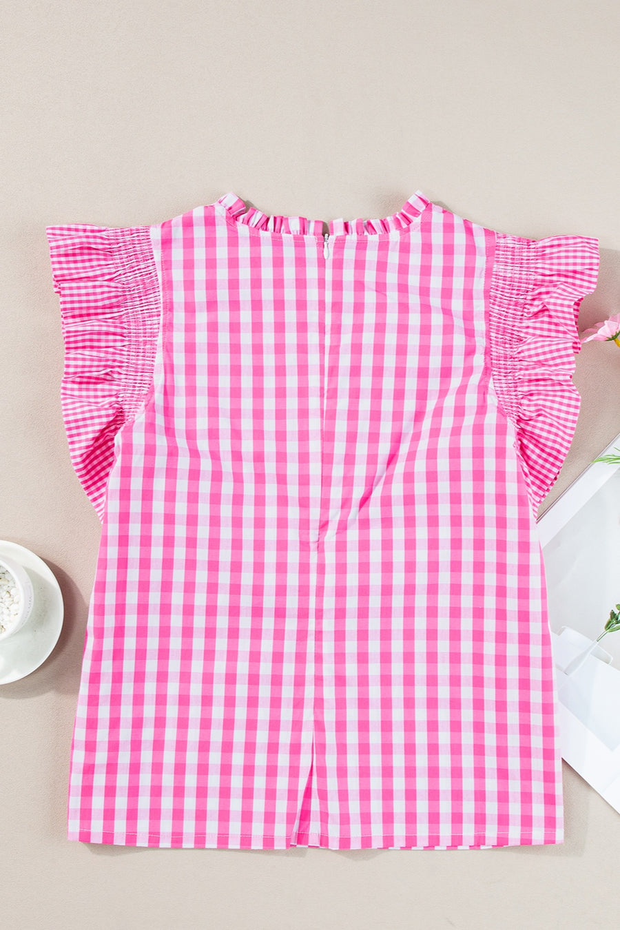 Fuchsia pink gingham ruffle sleeve mock neck blouse with smocked shoulder detail.