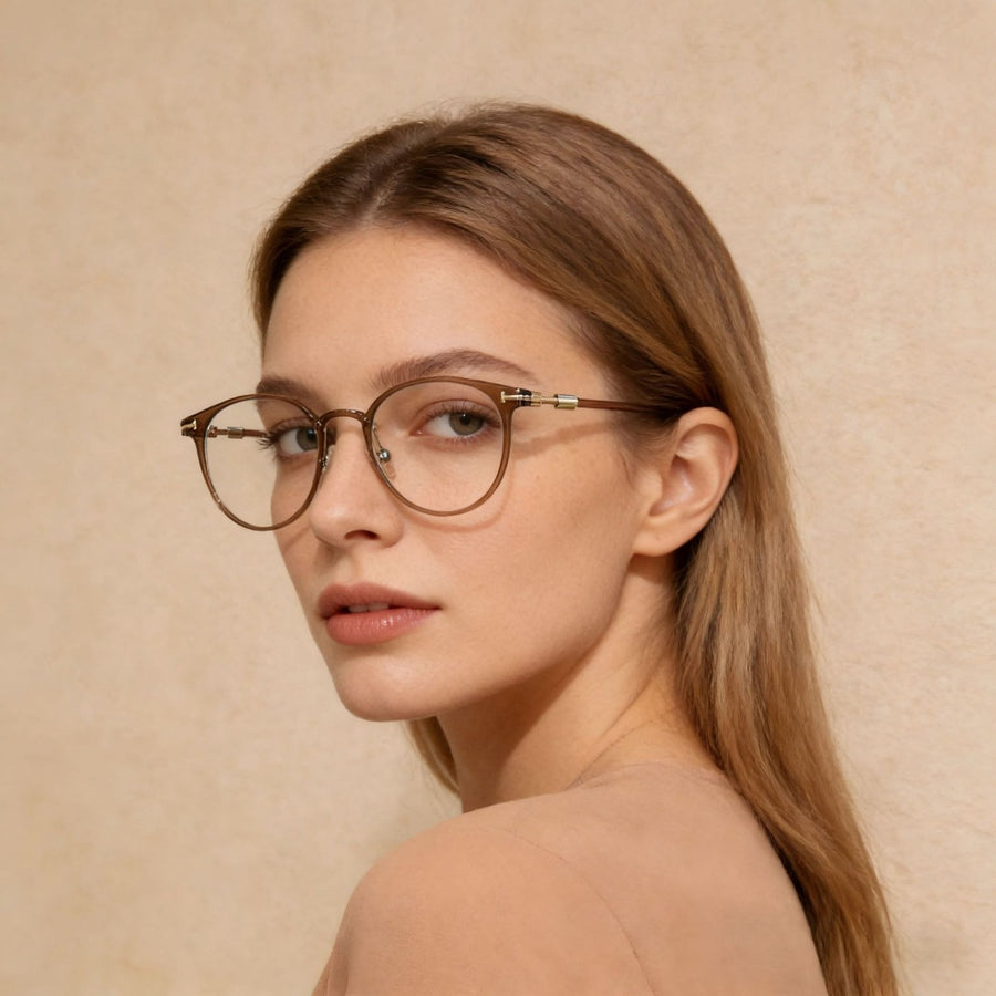 Translucent round frame glasses in caramel with gold accents on a woman.