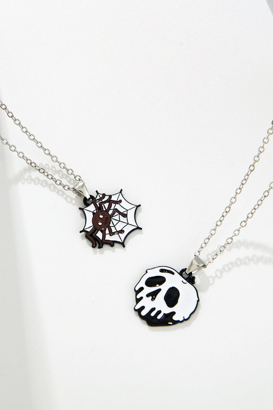 Spooky season enamel pendant necklaces with spider and skull charms