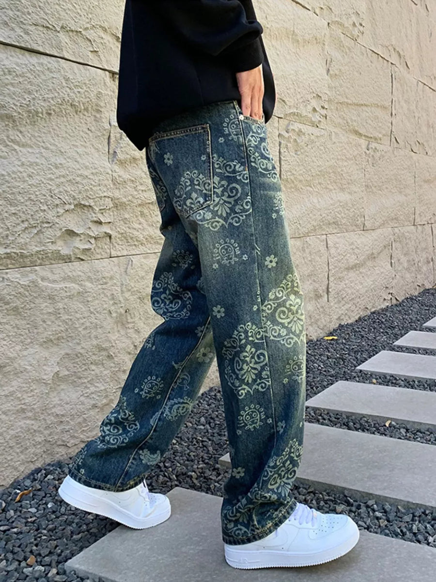 Men's relaxed fit jeans in dark wash denim with an all-over heritage floral print.