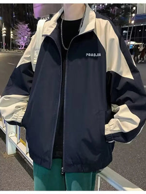 Plus-size two-tone windbreaker jacket in navy and cream with a zip front and elastic cuffs.