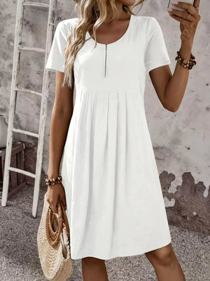 A-line dress in white featuring pleated and A-line fit