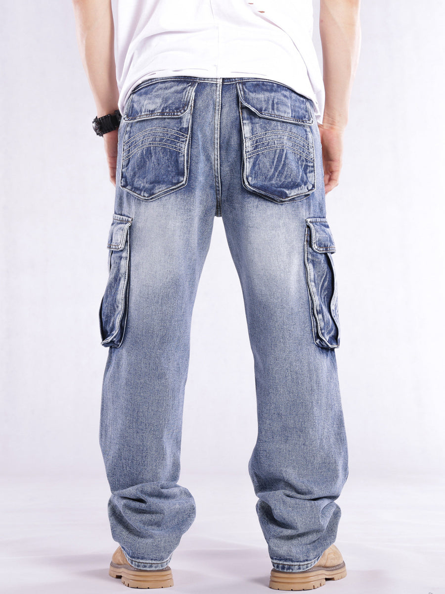 Relaxed fit light wash denim cargo jeans with flap pockets and contrast stitching.