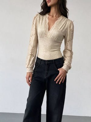 light beige fitted bodysuit with v-neck