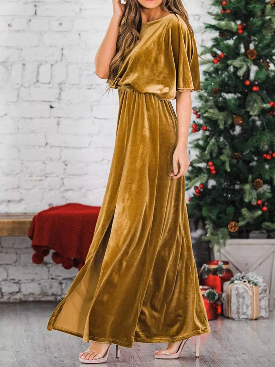 Gold velvet maxi dress with flutter sleeves, cinched waist, and high leg slits.