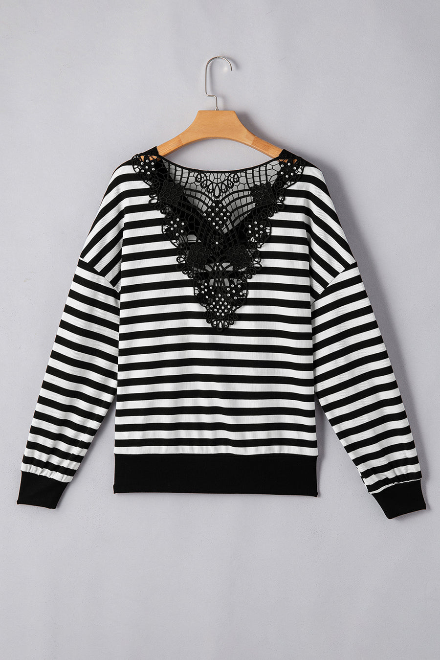 Black and white striped blouse with black lace detail on the back.