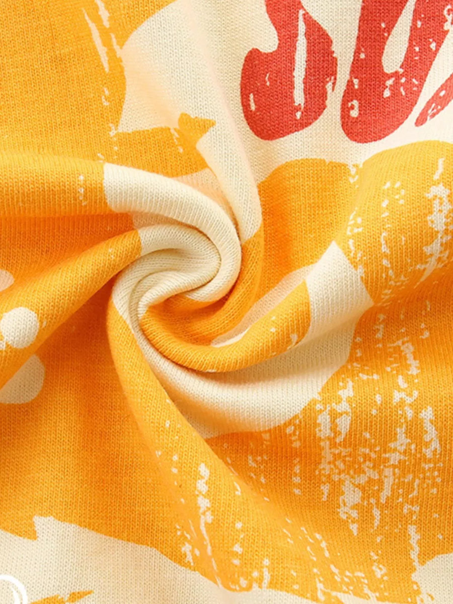 Baby cotton tee with orange graphic print and cream background.
