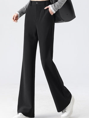 trousers in black featuring high-waisted and flared fit