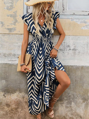 Dark blue geometric ruffled midi dress with a V-neck, smocked waist, and a high slit.
