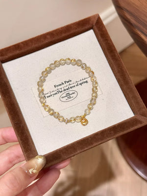 bracelet in gold featuring beaded and beaded strand fit