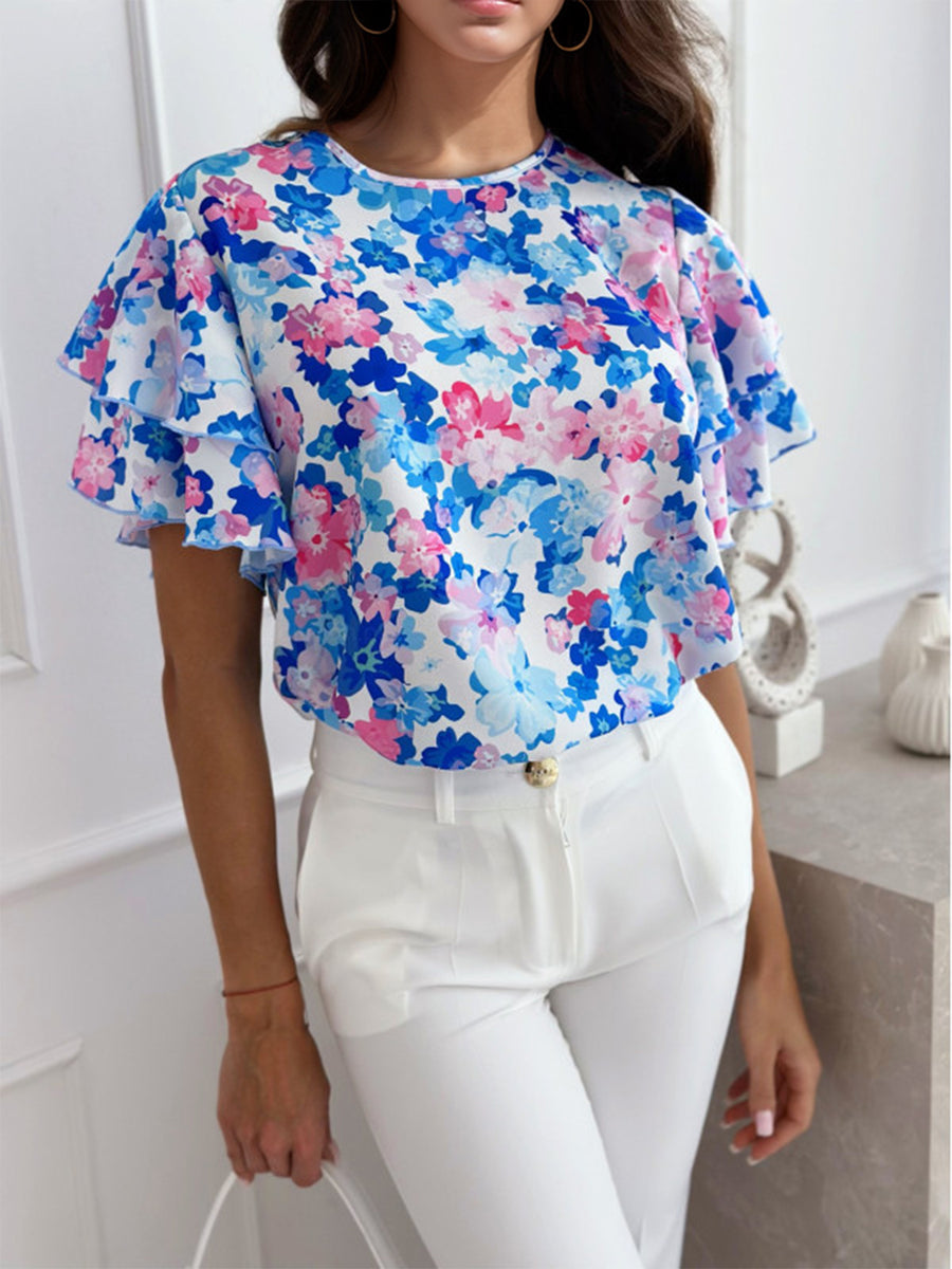 Watercolor floral blouse with ruffle sleeves and a crew neck.